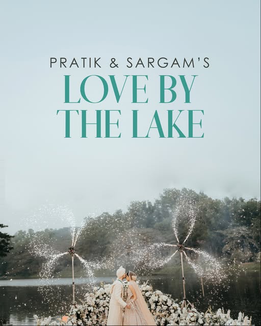 A couple at a misty lakeside wedding with sparkler fountains