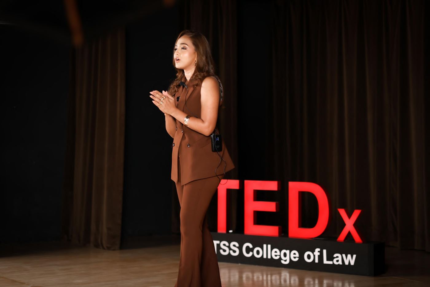 Reetu Jain speaking on the TEDx stage