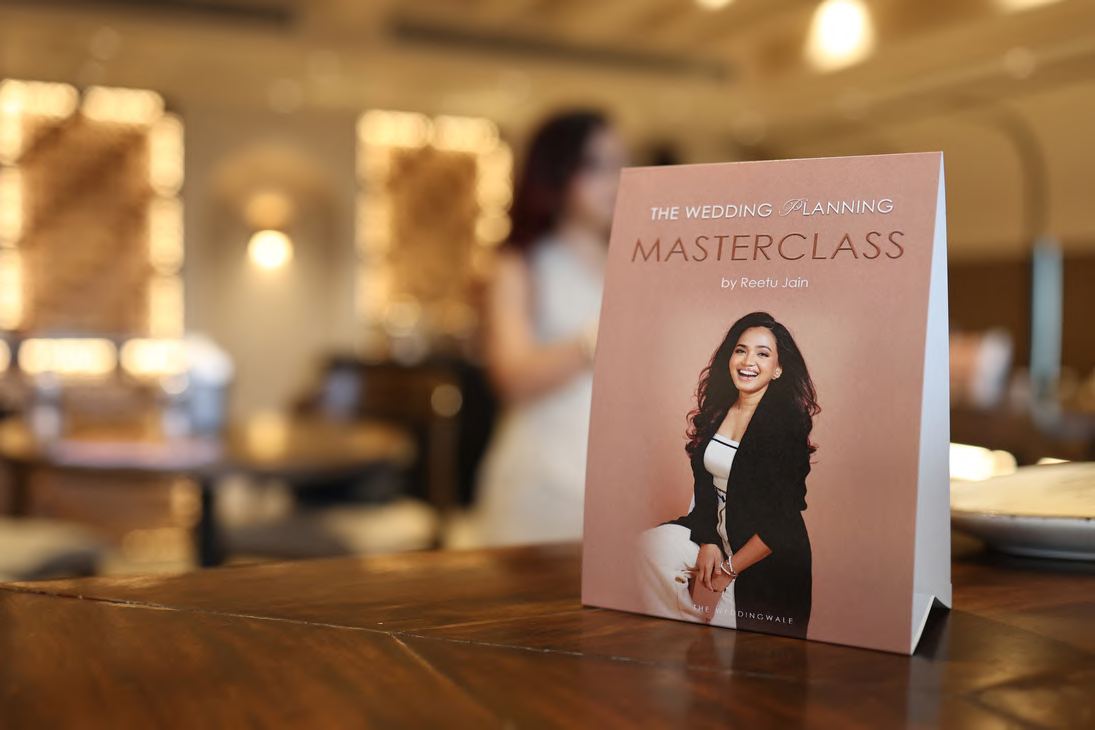 A Wedventure masterclass table card featuring Reetu Jain